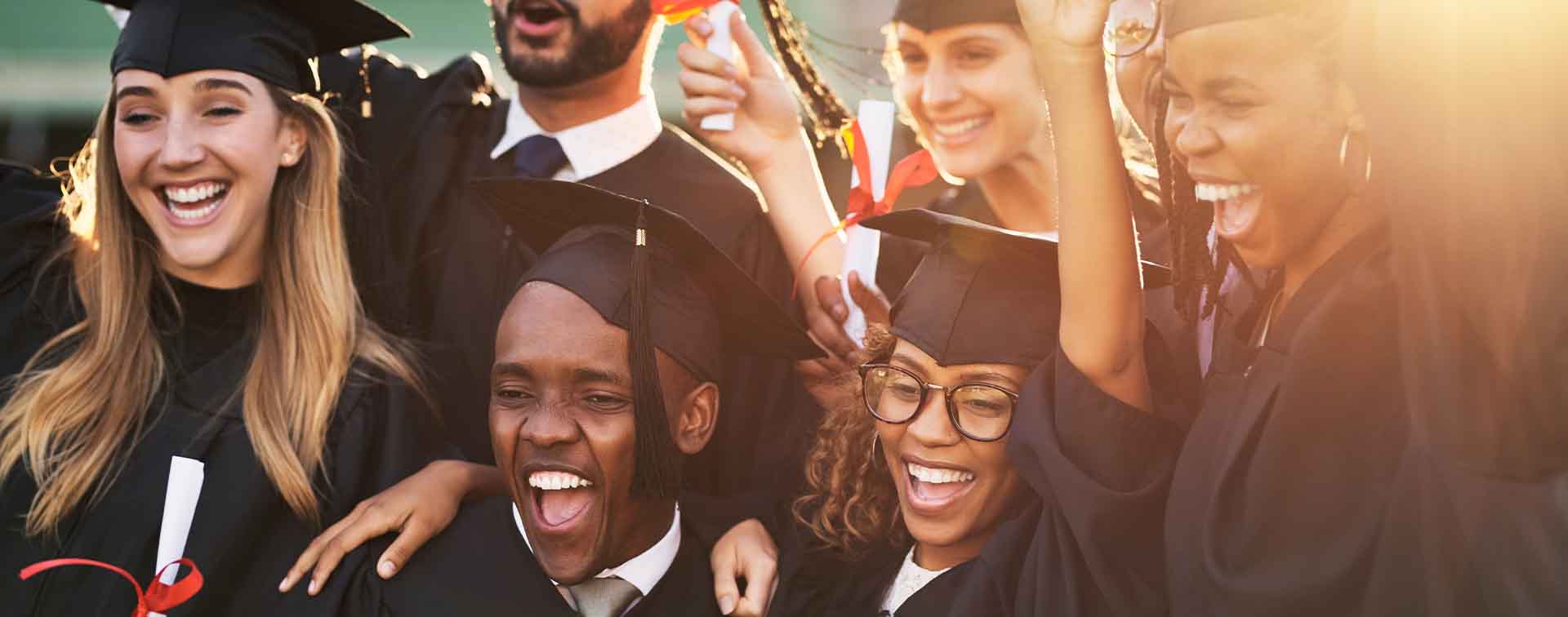 University students celebrating at graduation
