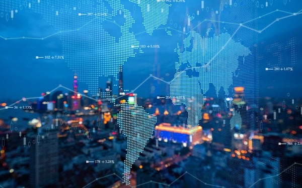 Glowing pixel map of the world with a graph spanning across it overlaid on a view of a city from a window