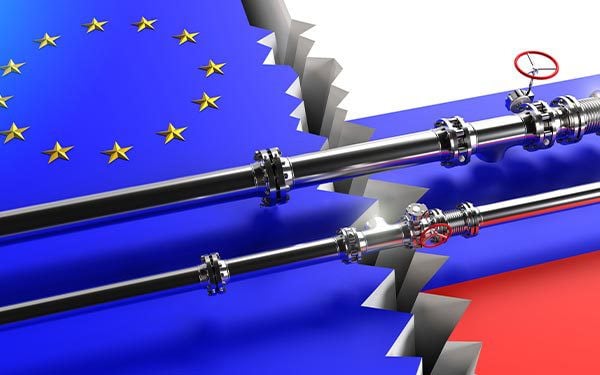 Digital composite image of a crack separating the UN flag with the Russian flag and two oil pipelines running across the crack.