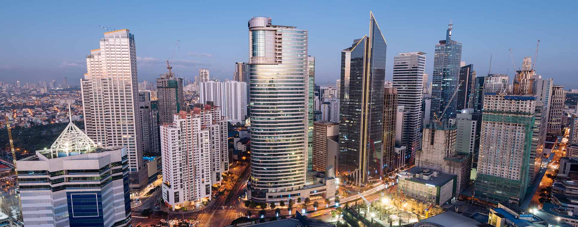 Bird aerial view of modern city high rise building against the sky